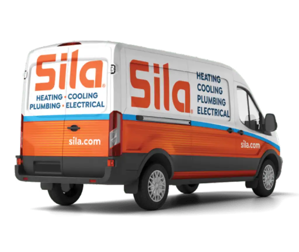 A white and orange Sila service van is parked, displaying the company’s name and services: heating, cooling, plumbing, and electrical. The website sila.com is visible on the rear and side.